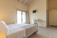 A bed or beds in a room at Agriturismo Colle Dei Pivi