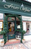 a store front with a green door with plants on it at Friars Wynd Guest Rooms in Stirling