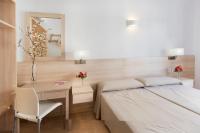 Postel nebo postele na pokoji v ubytování Hotel San Miguel