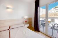 Postel nebo postele na pokoji v ubytování Hotel San Miguel