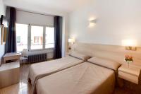 Postel nebo postele na pokoji v ubytování Hotel San Miguel