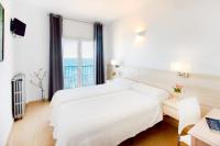 Postel nebo postele na pokoji v ubytování Hotel San Miguel