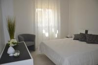 Posteľ alebo postele v izbe v ubytovaní Alba Apartment - Villaggio di Mary