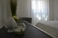 Posteľ alebo postele v izbe v ubytovaní Alba Apartment - Villaggio di Mary