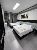 Postel nebo postele na pokoji v ubytování Retrol Hotel