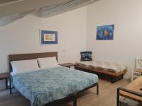A bed or beds in a room at Carrera Home Appartamenti Verona - Bike Hotel