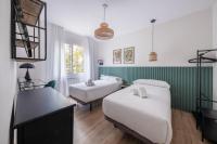 Postel nebo postele na pokoji v ubytování BeBarceloner Eixample Apartments- 4 bedrooms
