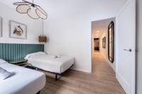 Postel nebo postele na pokoji v ubytování BeBarceloner Eixample Apartments- 4 bedrooms