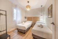 Postel nebo postele na pokoji v ubytování BeBarceloner Eixample Apartments- 4 bedrooms