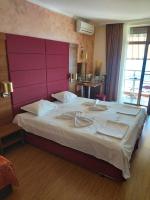 A bed or beds in a room at Guest House Skalite