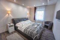 Posteľ alebo postele v izbe v ubytovaní Németh Apartman Sárvár