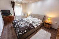Posteľ alebo postele v izbe v ubytovaní Németh Apartman Sárvár