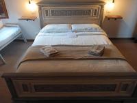A bed or beds in a room at casa vacanze Castiglione - 4 posti letto