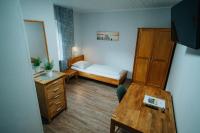 Postel nebo postele na pokoji v ubytování Hotel Leo