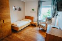Postel nebo postele na pokoji v ubytování Hotel Leo