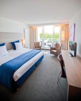 Ein Bett oder Betten in einem Zimmer der Unterkunft Sanadome Hotel & Spa Nijmegen