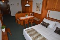 Posteľ alebo postele v izbe v ubytovaní Hotel Cristallino d'Ampezzo