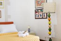 Postel nebo postele na pokoji v ubytování Camera con bagno privato vista mare Ortigia