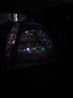 a rear view mirror of a car in the dark at Camping rock in Itanhaém