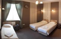 Posteľ alebo postele v izbe v ubytovaní Hotel Nad Rzeczką