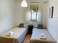 Łóżko lub łóżka w pokoju w obiekcie Apartamento Tamango Hill