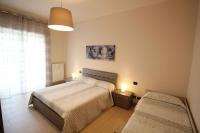 A bed or beds in a room at Appartamenti Colombo