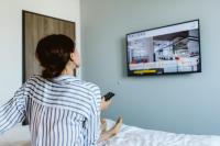 Televízia a/alebo spoločenská miestnosť v ubytovaní Hotel Rainers21