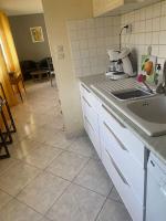 Kuchyňa alebo kuchynka v ubytovaní logement complet 2 chambres garage wifi de 1 a 5 voyageurs