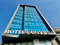 a building with a hotel on top of it at ONYX by luna in Oran