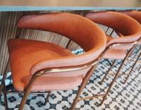 two orange chairs sitting next to each other at Cambria Hotel El Centro - Imperial in El Centro