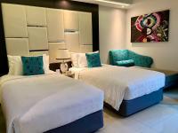 Postel nebo postele na pokoji v ubytování Hotel Clover Asoke - SHA Extra Plus