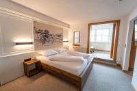 Łóżko lub łóżka w pokoju w obiekcie Sporthotel Igls