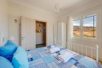 Posteľ alebo postele v izbe v ubytovaní Poseidonia Syros cozy house