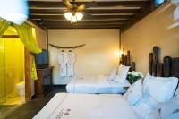 Big Tree Guesthouse - Naxi old styleにあるベッド
