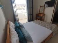 Posteľ alebo postele v izbe v ubytovaní Apollonia Apartments