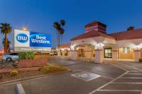 a hotel with a best western sign in a parking lot at Best Western Phoenix Goodyear Inn in Goodyear