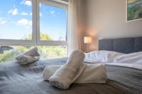 A bed or beds in a room at Vacation Home in Prater - Central, Garden and Sauna