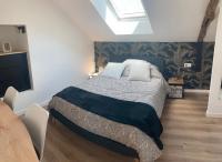 Łóżko lub łóżka w pokoju w obiekcie Gîte La Terrasse du 37