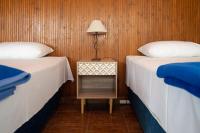 Posteľ alebo postele v izbe v ubytovaní Hôtel Argo