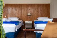 Posteľ alebo postele v izbe v ubytovaní Hôtel Argo