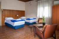 Posteľ alebo postele v izbe v ubytovaní Hôtel Argo