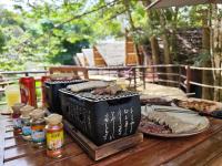 a table with food on it with plates of food at Longoza Ecolodge in Andasibe