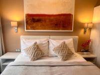 Postel nebo postele na pokoji v ubytování Grand Petit Hotel ex Shato Gesson
