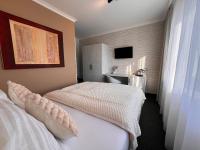 Postel nebo postele na pokoji v ubytování Grand Petit Hotel ex Shato Gesson