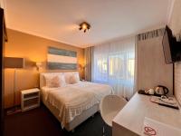 Postel nebo postele na pokoji v ubytování Grand Petit Hotel ex Shato Gesson