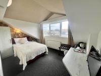 Postel nebo postele na pokoji v ubytování Grand Petit Hotel ex Shato Gesson