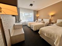 Postel nebo postele na pokoji v ubytování Grand Petit Hotel ex Shato Gesson