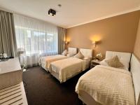 Postel nebo postele na pokoji v ubytování Grand Petit Hotel ex Shato Gesson