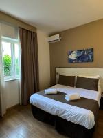 Łóżko lub łóżka w pokoju w obiekcie Hotel La Pergola