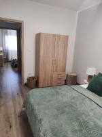 Posteľ alebo postele v izbe v ubytovaní Centrum Apartman Kőszeg